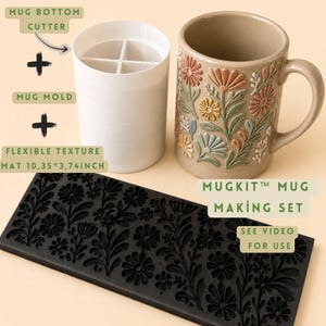 May include: A MugKit mug making set featuring a white mug bottom cutter, a white mug mold, and a black rectangular flexible texture mat measuring 10.35 by 3.74 inches. A beige ceramic mug with a raised, multi-coloured floral relief pattern is included.