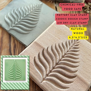 May include: A natural wood stamp with a leaf design, measuring 4.3 x 4.3 inches. The image also shows a gray clay stamp and a green tile with the same leaf pattern. Text on the image reads: "CHEMICAL-FREE FOOD SAFE" and "POTTERY CLAY STAMP COOKIE DOUGH STAMP AIR DRY CLAY STAMP".