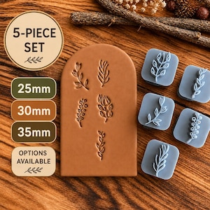 May include: A 5-piece set of light blue square stamps featuring botanical leaf and floral designs, alongside a tan arch-shaped clay slab embossed with the same five plant patterns. Text labels indicate 25mm, 30mm, and 35mm size options.