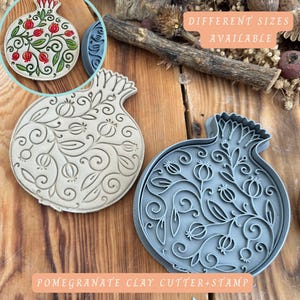 May include: Pomegranate clay cutter and stamp set. The set includes a beige clay cutter and a blue clay stamp, both in the shape of a pomegranate with floral and fruit designs. The text "DIFFERENT SIZES AVAILABLE" is visible in the image.