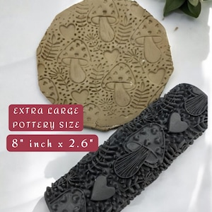 May include: Two pottery tools with mushroom and heart designs. One is a circular stamp, approximately 8 inches in diameter, and the other is a rectangular roller, 2.6 inches wide. The text on the image reads "EXTRA LARGE POTTERY SIZE".