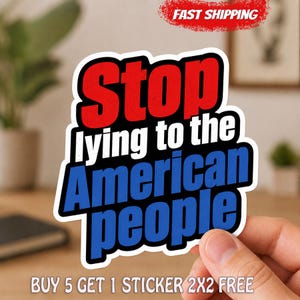May include: A die-cut sticker featuring the text Stop lying to the American people in bold, stacked lettering. The word Stop is in red, while the words lying to the American people are in blue. The entire phrase is outlined in thick black and white.