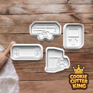 May include: Four white plastic cookie cutters shaped like video game consoles and controllers. The set includes a console, a handheld device, and a controller. The Cookie Cutter King logo is in the bottom right corner.