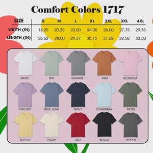 May include: A graphic showing a variety of Comfort Colors 1717 t-shirts in various colors, including white, bay, granite, yam, blossom, orchid, blue jean, navy, chambray, moss, butter, ivory, red, black, and pepper. The image also includes a size chart with measurements in inches.