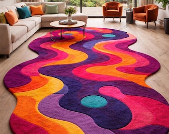 May include: A vibrant, abstract area rug with a wavy, organic shape. The rug features a bold color palette of purple, orange, pink, and teal. This statement piece adds a pop of color and modern flair to any living space.