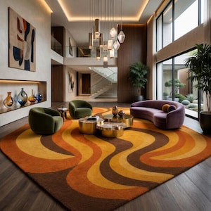 May include: A modern living room featuring a large, patterned rug in shades of brown, orange, and yellow. The room includes a curved purple sofa, green armchairs, and gold accent tables. A large painting and decorative vases add to the decor.