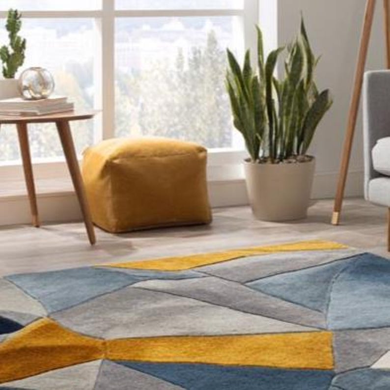 Luxury wool rug combining art and geometry, handmade for UK and European modern homes with a cozy yet designer aesthetic. Modern geometric pattern rug crafted from natural wool, suitable for Scandinavian, British, and European interior styles.