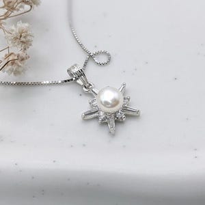Elegant Silver Starburst Pendant Necklace with 8mm Pearl Center, Sparkling CZ Stones, 18-inch Chain, Perfect Gift for Her