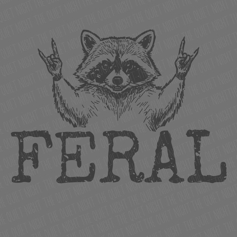 May include: A gray graphic featuring a raccoon making a rock and roll hand gesture. The word "FERAL" is printed in large, distressed letters below the raccoon. The background has a subtle pattern of the words "THE QUIET NIGHT".