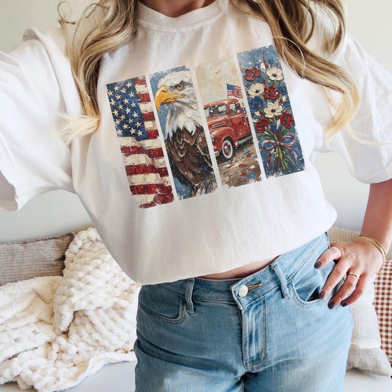 May include: White t-shirt featuring a patriotic design. The design includes an American flag, an eagle, a red truck, and a bouquet of flowers. The shirt is made of a soft material and is suitable for casual wear.