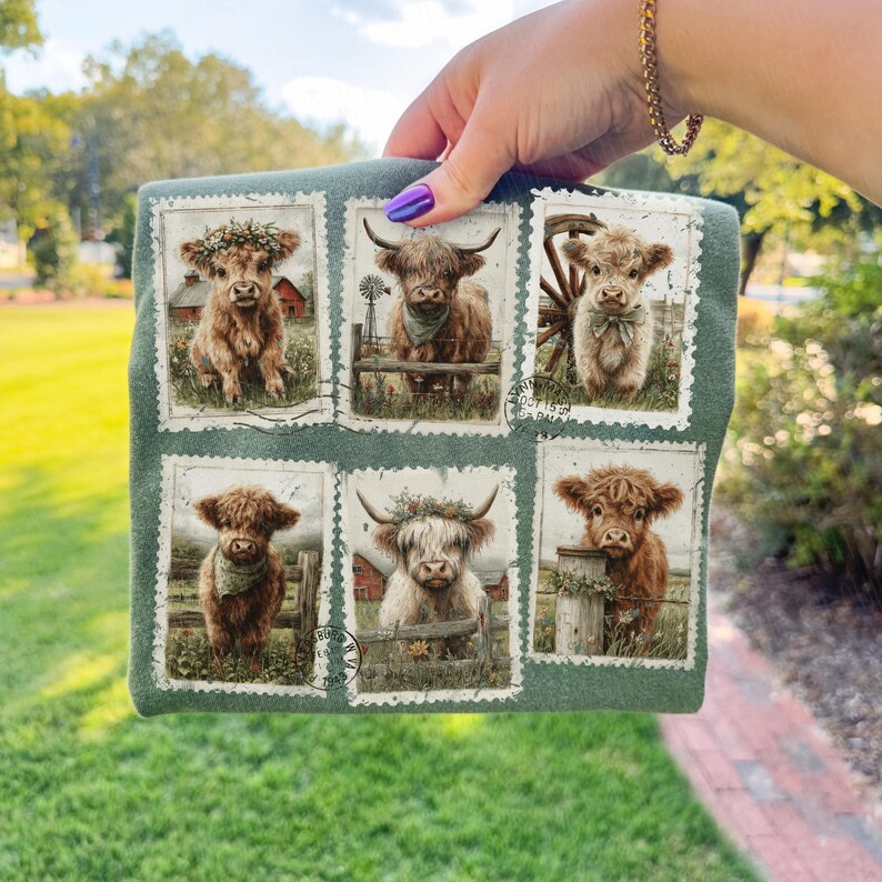 May include: A green fabric item featuring six postage stamp-style images of Highland cows. Each image showcases a different cow with various accessories, such as floral crowns and bandanas, set against a rural backdrop.
