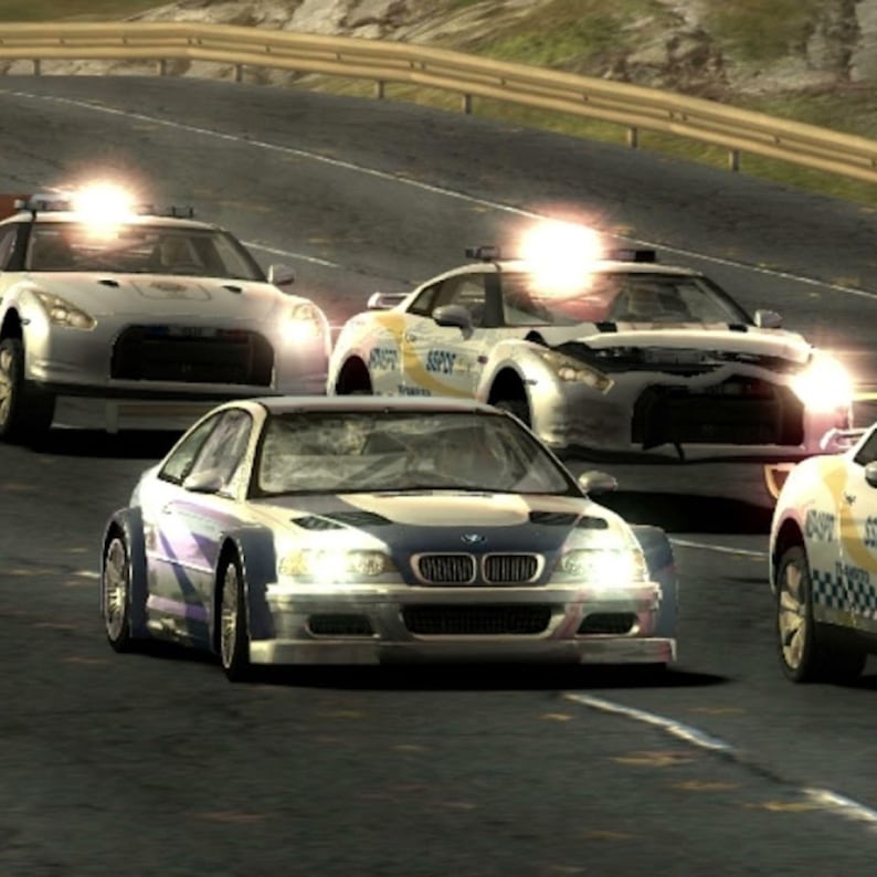 May include: A computer-generated image of a car chase on a highway. Several silver and white police cars with flashing lights pursue a blue and white sports car. The scene is set during the day.