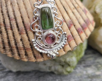 Handcrafted pink and green tourmaline in a sterling silver filigree pendant