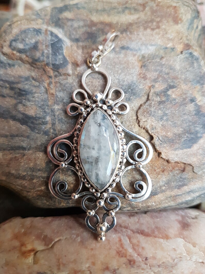 handcrafted sterling silver filigree pendant featuring a lovely iridescent moonstone cabochon. Original design