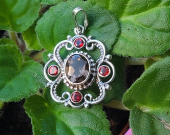 Sterling silver garnet and smoky quartz pendant