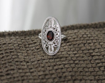 SOLD Original filigree design, handcrafted sterling silver filigree ring with 7x5mm garnet size 7.5