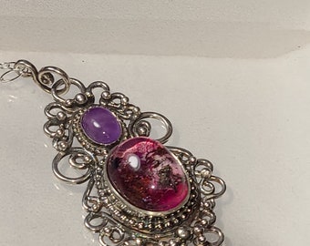 Handcrafted  sterling silver filigree pendant featuring a deep pink lodalite and an amethyst accent