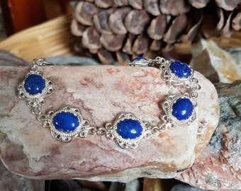 Beautiful handcrafted wirework sterling silver and 10x8 mm natural lapis gemstone bracelet.