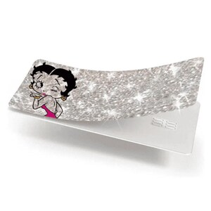 May include: A silver glittery card with a Betty Boop graphic. The card features a cartoon image of Betty Boop in a pink dress, blowing a kiss. The card is rectangular with rounded corners and a white back.