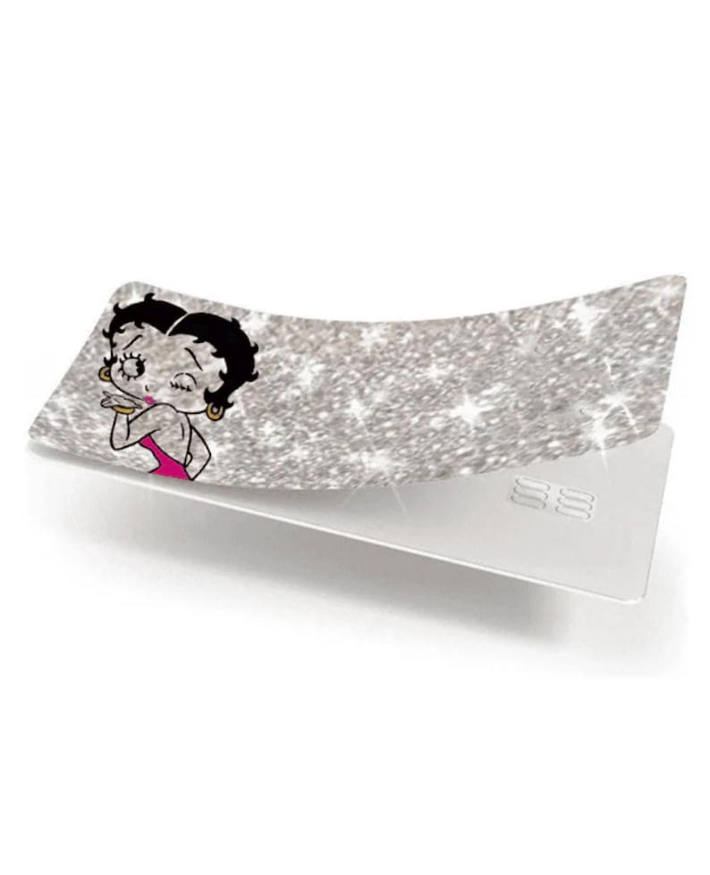 May include: A silver glittery card with a Betty Boop graphic. The card features a cartoon image of Betty Boop in a pink dress, blowing a kiss. The card is rectangular with rounded corners and a white back.