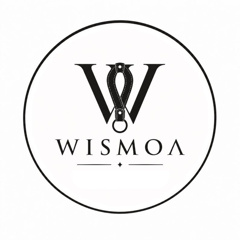 May include: A circular black and white logo featuring a large letter W with a leather-like strap loop and metal ring integrated into the center. Below the graphic, the text WISMOA is centered in a serif font, underlined by a thin line with a star.