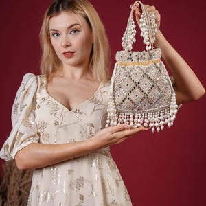 Champagne gold Pearl Potli Bag – Hand-Embroidered Pink Bridal Purse with Pearl Handle & Fringe | Indian Wedding Potli | Designer Festive Bag