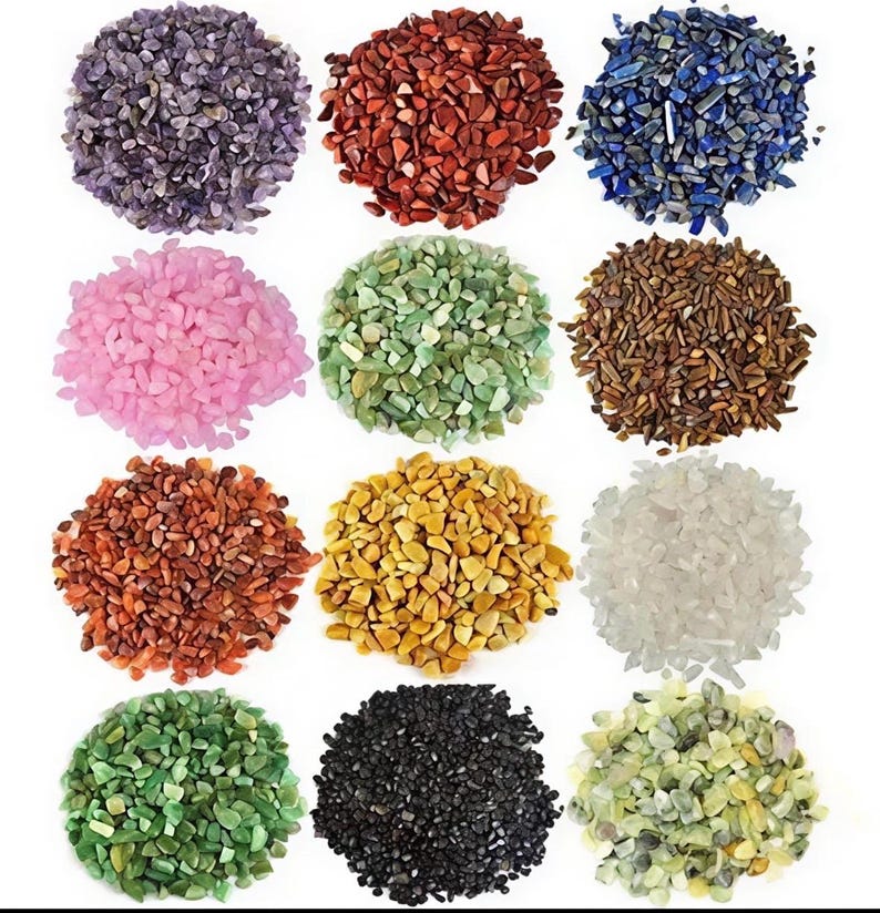 May include: A collection of small, colorful stones in various hues, including purple, red, blue, pink, green, brown, orange, yellow, and white. The stones are arranged in circular piles, showcasing their diverse colors and textures. Ideal for crafts and decorative purposes.