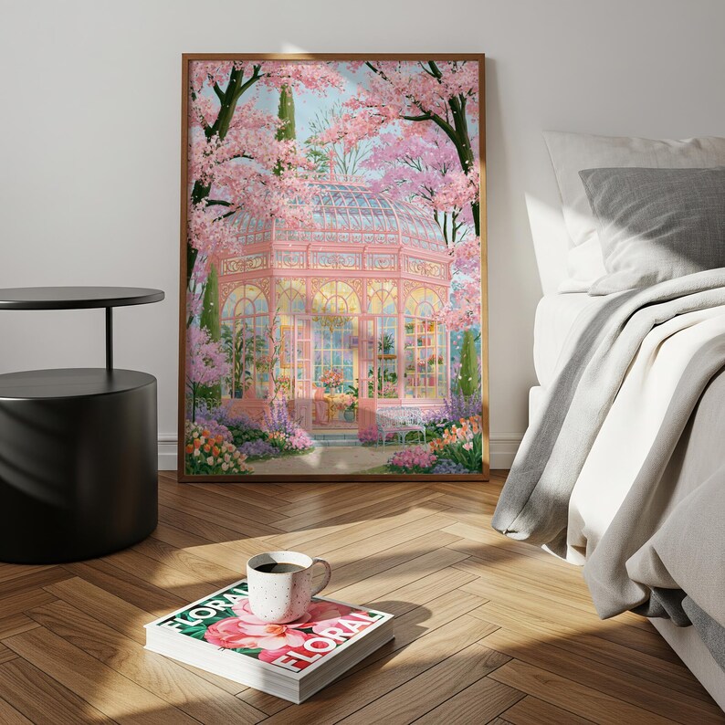 May include: A framed art print of a pink greenhouse surrounded by cherry blossom trees. The artwork features a floral theme with a cup of coffee on a magazine with the word "FLORAL" on the cover.