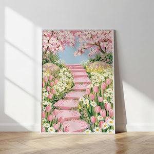 May include: A framed art print featuring a whimsical garden scene. A pink stone staircase leads upwards, surrounded by pink tulips, white daisies, and yellow wildflowers. Cherry blossom trees frame the top of the stairs, with a light blue sky in the background.
