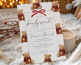 May include: A baby shower invitation with a cream background and a red bow at the top. The invitation features teddy bears wearing red plaid scarves. The text reads "We can bearly wait!" and includes the name Jessica David and event details.