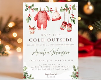 Może przedstawiać: Zaproszenie na baby shower z napisem "Baby It's Cold Outside". Zaproszenie zawiera akwarelowe ilustracje ubranek dla dzieci, renifera i zieleni. Zaproszenie jest dla Amelii Johnson, z datą i godziną wydarzenia.