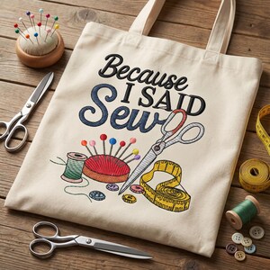 a beige tote bag with a humorous embroidered phrase, "Because I said sewing", surrounded by sewing-related items such as scissors, pins, and a measuring tape.
