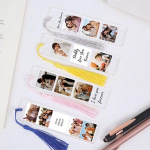 May include: Clear acrylic bookmarks with photo inserts and colorful tassels. Each bookmark features multiple photos and text that reads "Love You Forever", "Daddy Love You Forever", and "I love you forever".