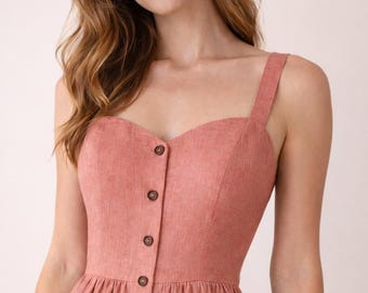 Abito midi in lino con scollo a cuore, abbottonatura frontale e linea ad A, realizzato a mano, ideale per un matrimonio estivo.