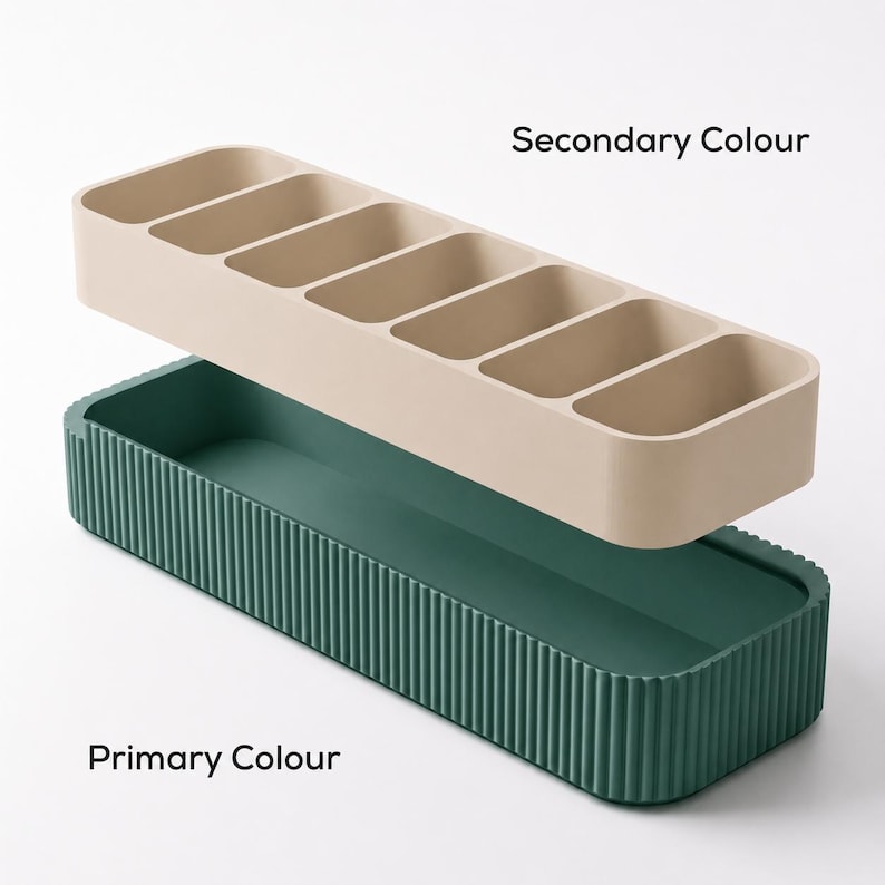 Minimalist storage tray with a ribbed base and removable compartment insert, shown in an exploded view.