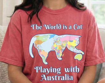 The World Is A Cat Playing With Australia Shirt - Funny Cat World Map Shirt - Geography Cat Shirt - Cat Lover Tee Gift