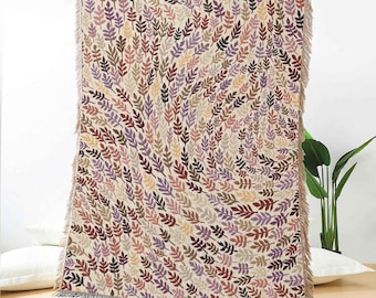 Manta tejida en jacquard con remolinos de hojas: manta botánica beige con hojas de colores para sofá, cama, decoración bohemia o un hogar inspirado en la naturaleza.