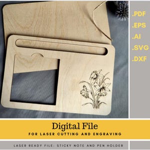 May include: A wooden sticky note and pen holder with a floral design, suitable for laser cutting and engraving. The holder features a rectangular cutout and a groove for pens. The text "Digital File" is displayed.