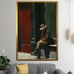 May include: A framed print of a painting depicting a man in a brown coat and hat sitting on a bench. The background features a red door and a dark green wall, with a gold frame.