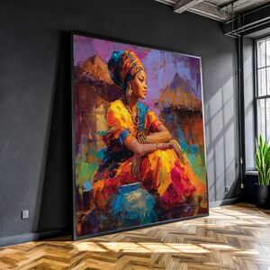 Könnte beinhalten: Großer gerahmter Kunstdruck einer Frau in traditioneller Kleidung. Das Gemälde zeigt eine Frau mit Kopftuch, Schmuck und einem leuchtend gelben und orangefarbenen Kleid. Ein blauer Topf befindet sich im Vordergrund, mit einer Dorfszene im Hintergrund.