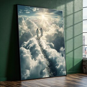 May include: Framed art print showing two figures walking on a cloud path towards a bright sun. The artwork features a sky filled with fluffy white clouds and a radiant sunburst, creating a heavenly scene.