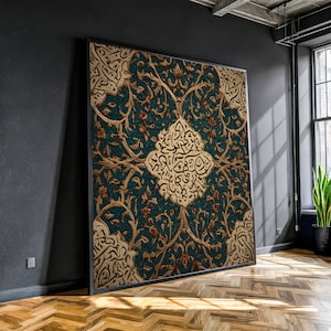 May include: Large framed artwork with an intricate floral and calligraphic design. The artwork has a teal background with gold and brown floral patterns and a central gold medallion with calligraphy. The frame is black.