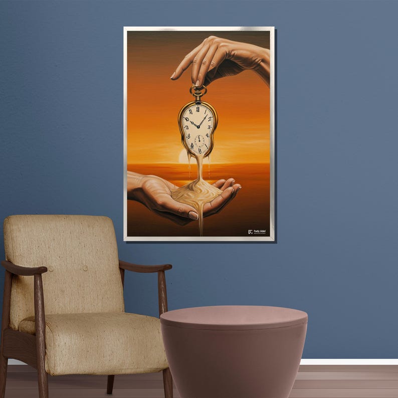 May include: A framed art print depicting a surrealist scene. A pocket watch is held by a hand, its face melting into sand caught in another hand. The background shows a sunset, with warm orange and yellow hues.