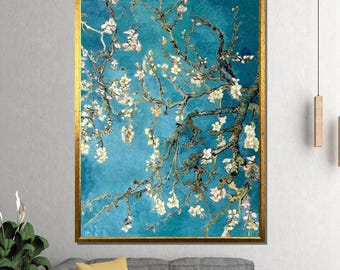 May include: A framed print of a painting depicting a flowering almond tree branch against a teal backdrop. The artwork has a gold frame and is a reproduction of a famous painting.