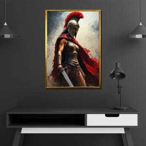 May include: A framed artwork depicts a warrior in ancient armor, holding a sword. The warrior wears a red cape and a helmet with a red plume. The artwork has a gold frame and is displayed on a dark gray wall.