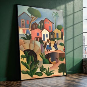 Puede incluir: Una pintura enmarcada que representa una escena de pueblo colorida. La obra presenta casas en tonos rojos, azules y amarillos, con figuras de personas. Un puente y exuberantes plantas verdes est&aacute;n en primer plano, con un cielo azul arriba.