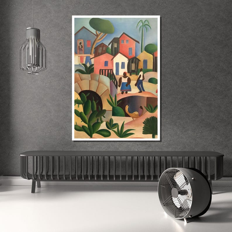 Puede incluir: Una pintura enmarcada representa una colorida escena de pueblo. La obra presenta casas en tonos rojos, azules y amarillos, con figuras de personas y exuberante vegetaci&oacute;n verde. Tambi&eacute;n se ve un puente y un arco.