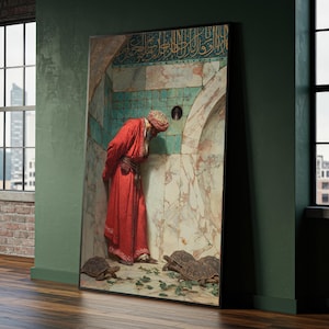 May include: A framed print of an orientalist painting. The artwork depicts a man in a red robe and turban looking into a hole in a marble wall. Several turtles are on the ground. The background features turquoise tiles and Arabic script.
