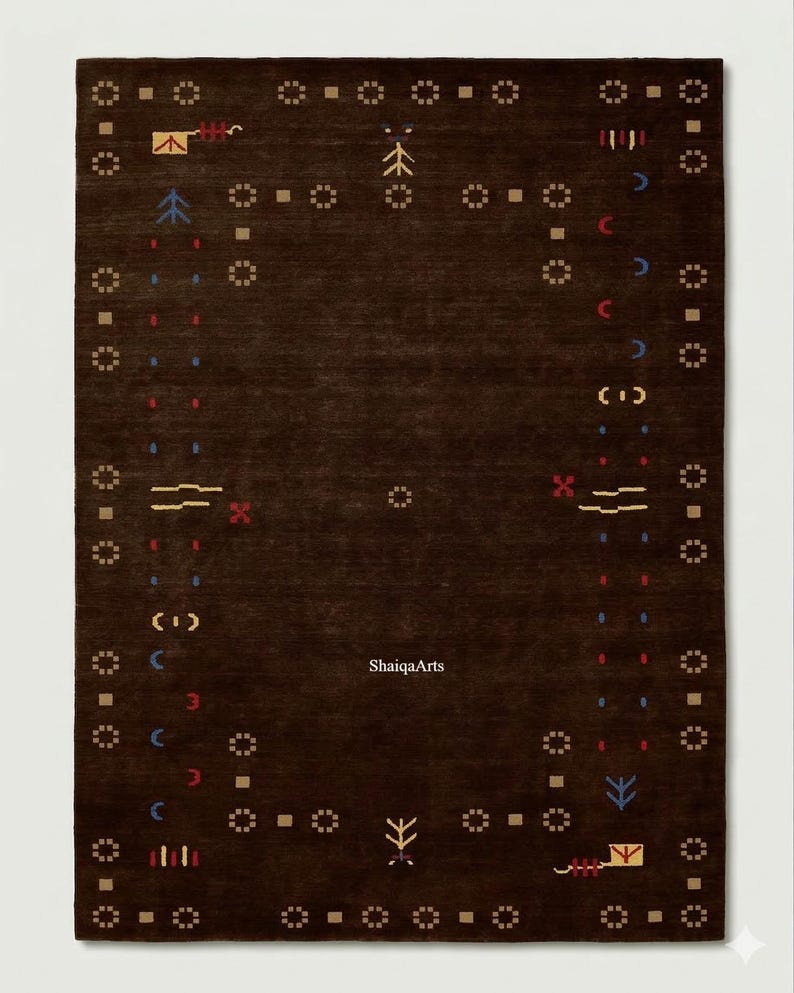 May include: A dark brown rectangular rug with a repeating geometric pattern in tan, red, blue, and yellow. The rug features a central design and a border with small square and circular motifs. The text "ShaigaArts" is visible.
