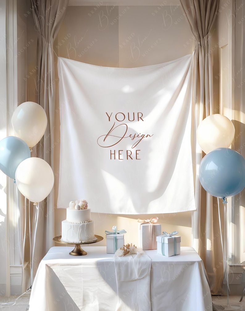 May include: A staged event scene with a white tablecloth, cake, gifts, and balloons. A two-tiered white cake sits on a gold cake stand. The backdrop features a white banner with the text "YOUR Design HERE". Balloons in white and blue are arranged around the scene.